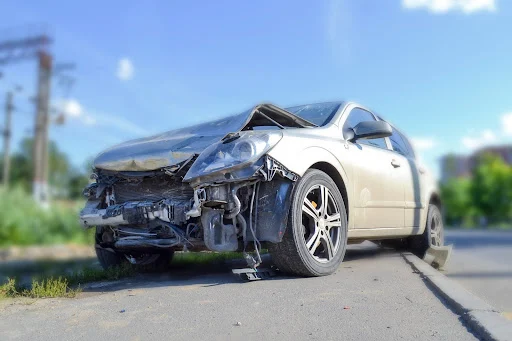 Salvaged vehicle with damage in the front.