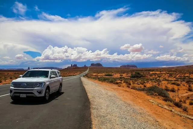 SUV parked on side of highway in Arizona