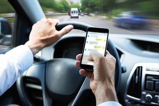 a person texting and driving